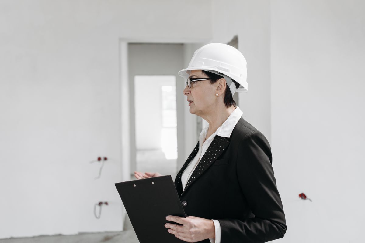 Safety engineer documenting findings during a workplace safety inspection