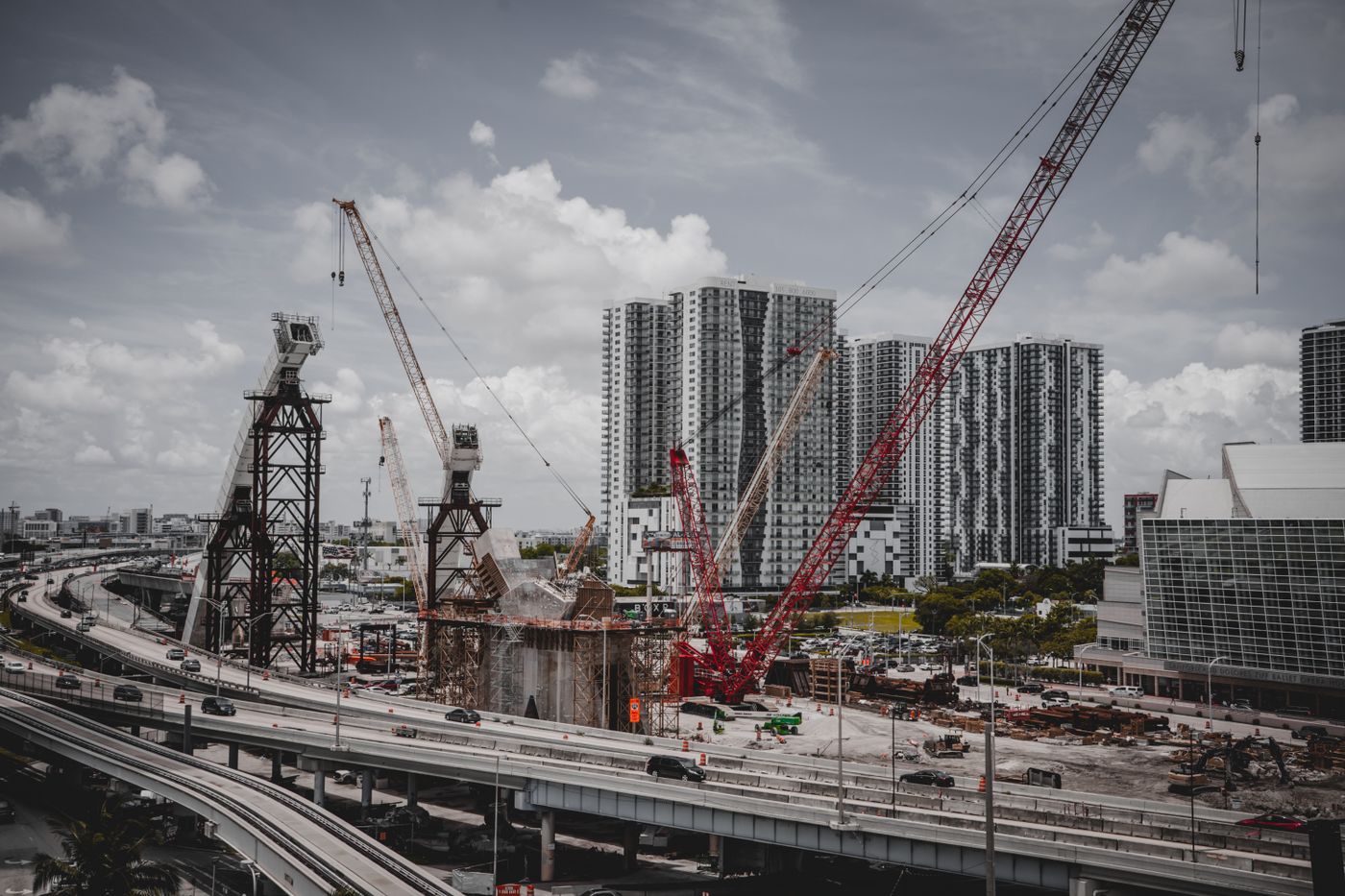 Large construction site with cranes where an incident scene is being documented